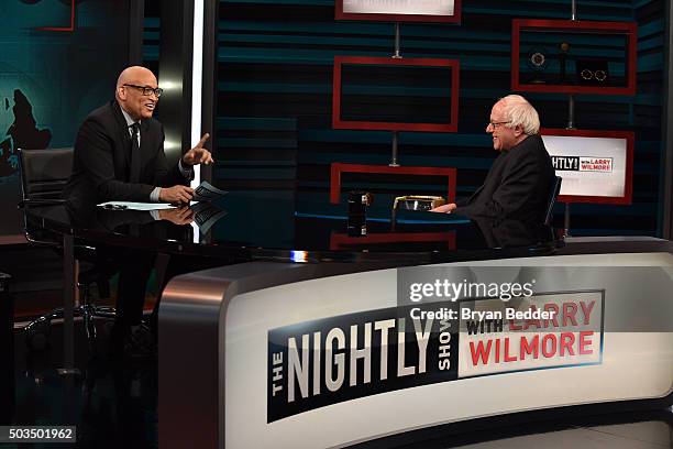 Host Larry Wilmore speaks with Senator Bernie Sanders on Comedy Central's "The Nightly Show With Larry Wilmore" on January 5, 2016 in New York City.