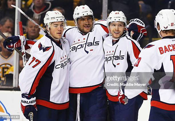Evgeny Kuznetsov of the Washington Capitals, second from right, celebrates with T.J. Oshie, Alex Ovechkin and Nicklas Backstrom after scoring a goal...