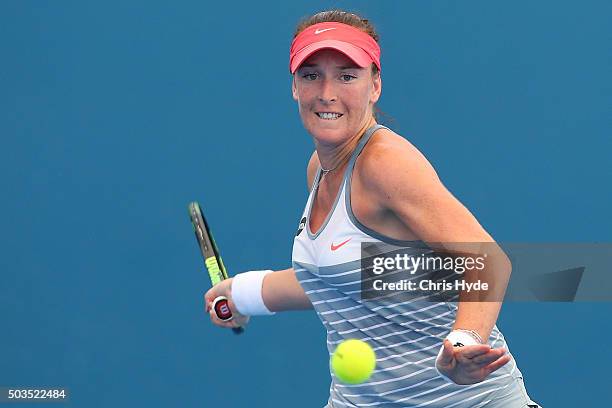 Madison Brengle of the USA plays a forehand in her match against Angelique Kerber of German during day four of the 2016 Brisbane International at Pat...