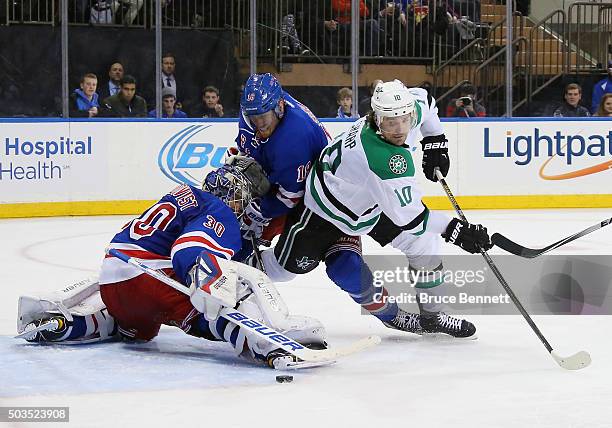 Henrik Lundqvist and Marc Staal of the New York Rangers combine to stop Patrick Sharp of the Dallas Stars during the third period at Madison Square...