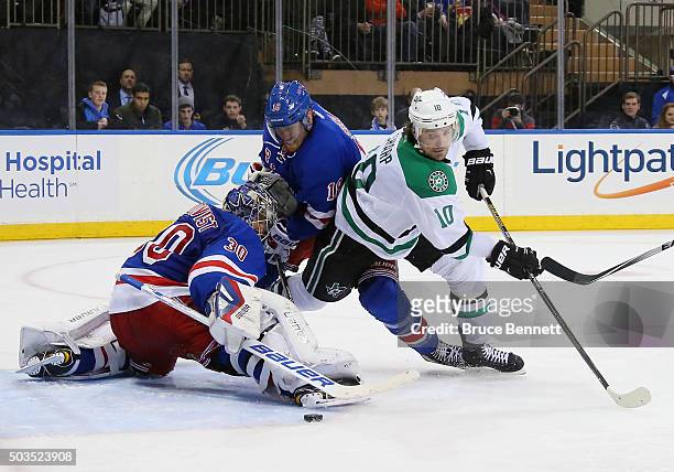 Henrik Lundqvist and Marc Staal of the New York Rangers combine to stop Patrick Sharp of the Dallas Stars during the third period at Madison Square...