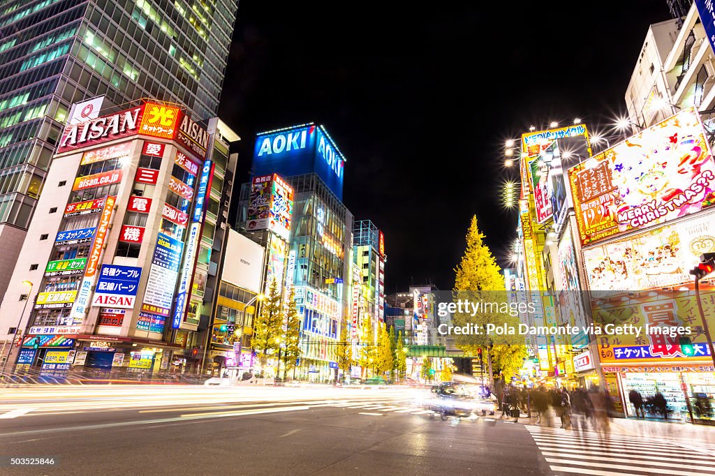 Akihabara Electric Town at night with car light trails at street