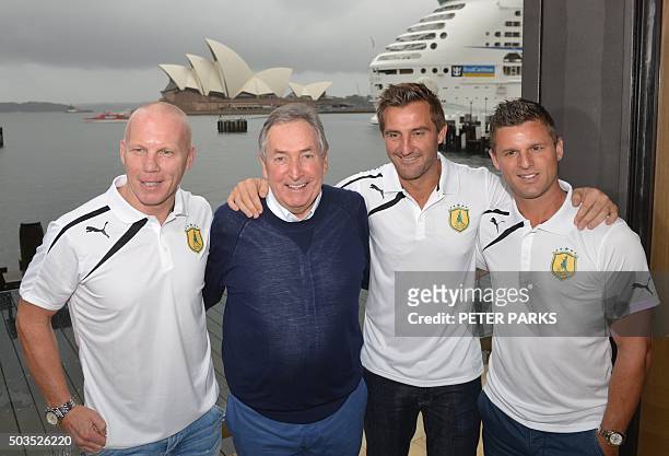Former Liverpool manager Gerard Houllier stand with Australia 'Legends' football players Jason Culina David Zdrilic and Robbie Slater at a press...