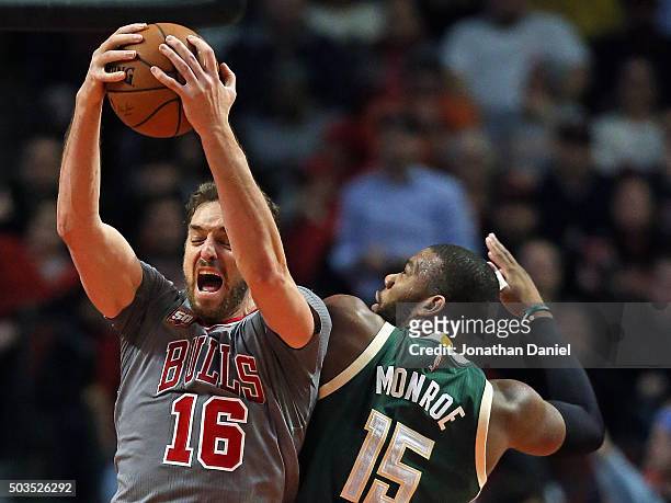 Pau Gasol of the Chicago Bulls rebounds over Greg Monroe of the Milwaukee Bucks at the United Center on January 5, 2016 in Chicago, Illinois. The...
