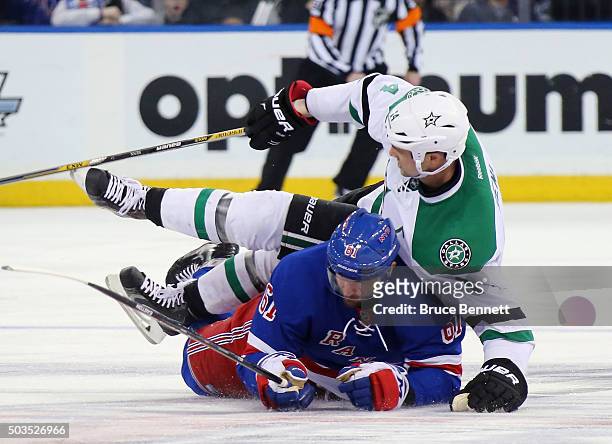 Rick Nash of the New York Rangers gets under Jamie Benn of the Dallas Stars during the second period at Madison Square Garden on January 5, 2016 in...