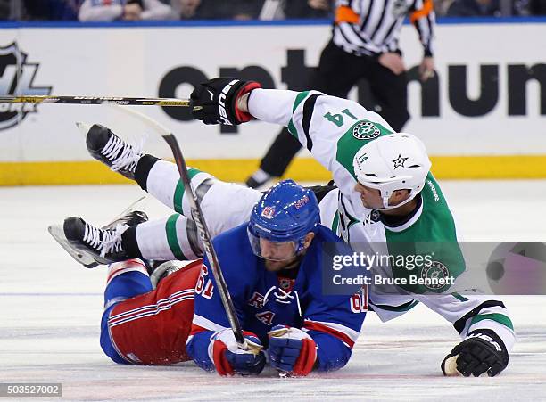 Rick Nash of the New York Rangers gets under Jamie Benn of the Dallas Stars during the second period at Madison Square Garden on January 5, 2016 in...