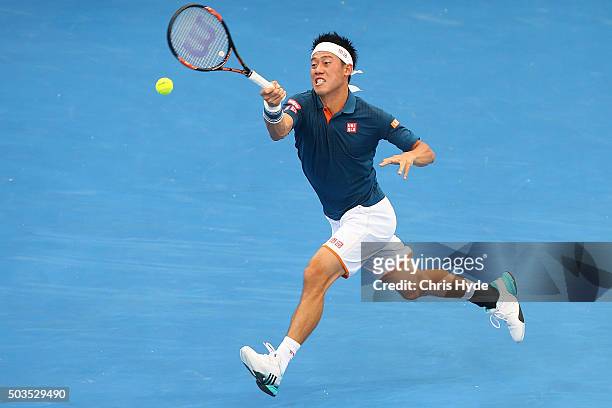 Kei Nishikori of Japan plays a forehand in his match against Mikhail Kukushkin of Kazakhstan during day four of the 2016 Brisbane International at...