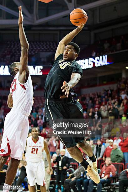 Damian Jones of the Vanderbilt Commodores goes up for the game-tying dunk in regulation over Moses Kingsley of the Arkansas Razorbacks at Bud Walton...