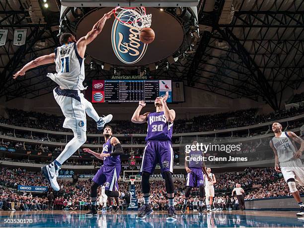 JaVale McGee of the Dallas Mavericks throw down the alley-oop against the Sacramento Kings on January 5, 2016 at the American Airlines Center in...