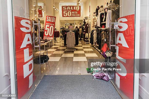 Shop offering generous discounts during the winter sales in downtown Rome, Italy. The first day of winter sales in many Italian cities begins and...
