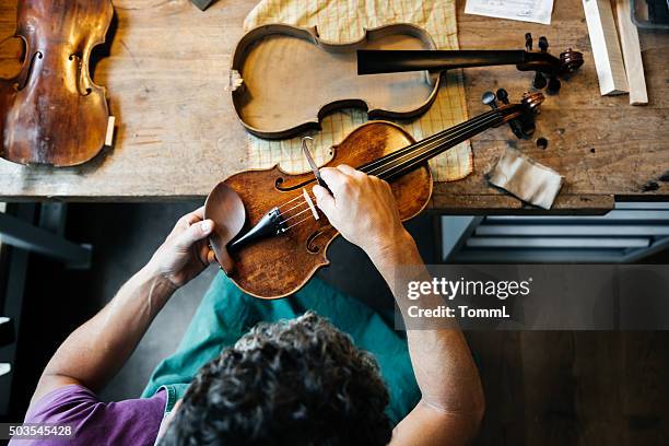 violin maker working on workbench - instrument maker stock pictures, royalty-free photos & images