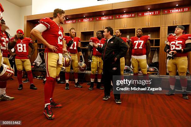 Head Coach Jim Tomsula of the San Francisco 49ers address the team in the locker room during halftime of the game against the St. Louis Rams at Levi...