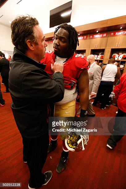 Head Coach Jim Tomsula of the San Francisco 49ers congratulates Ian Williams on the locker room following the game against the St. Louis Rams at Levi...