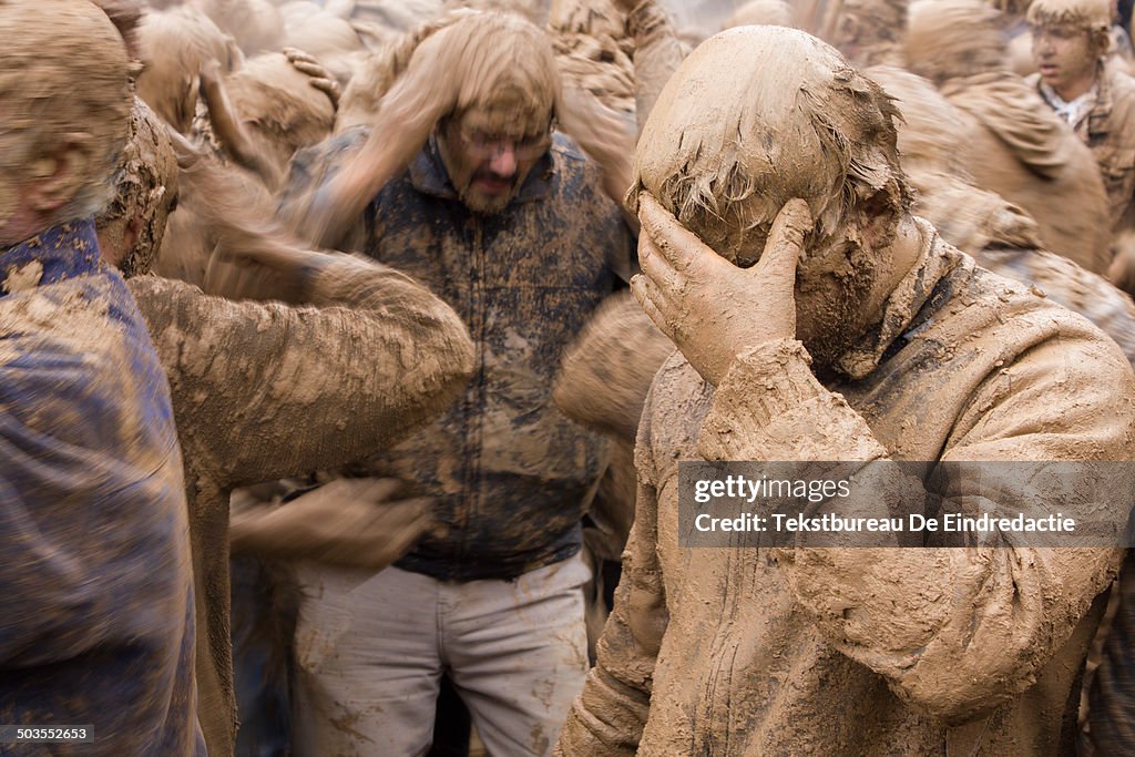 Muslim men covered in mud on Ashura Day, Iran