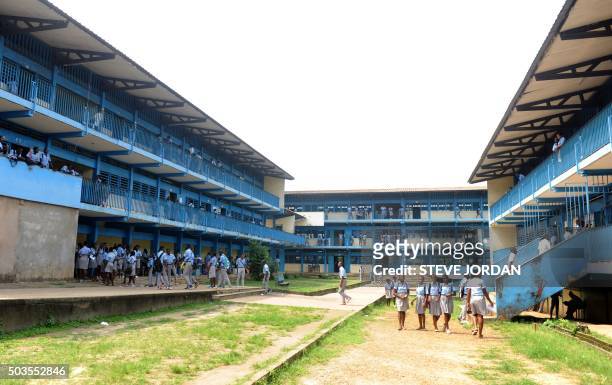 Students stand in the courtyard of their school in Libreville on January 5, 2016 after Gabon teachers launched a one-month strike in schools around...