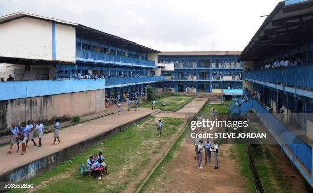 Students stand in the courtyard of their school in Libreville on January 5, 2016 after Gabon teachers launched a one-month strike in schools around...