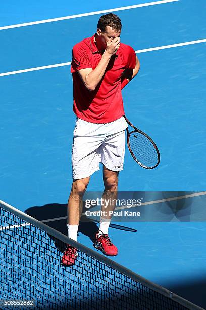 Kenny De Schepper of France reacts after missing a shot in the mixed doubles match against Sabine Lisicki and Alexander Zverev of Germany during day...