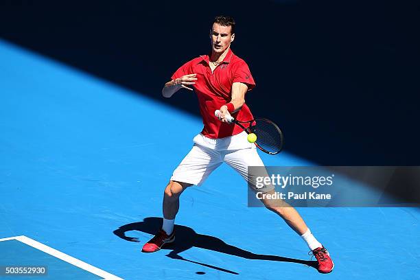 Kenny De Schepper of France plays a forehand in the mixed doubles match against Sabine Lisicki and Alexander Zverev of Germany during day four of the...