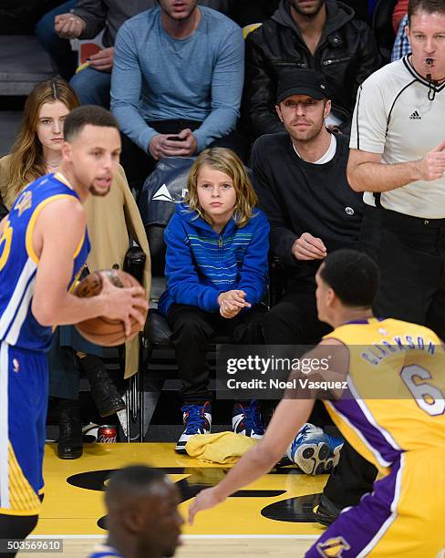 Moses Martin and Chris Martin attend a basketball game between the Golden State Warriors and the Los Angeles Lakers at Staples Center on January 5,...