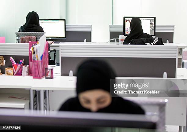 Riad, Saudi Arabia A young Arab women sitting in front of computers in the employment agency for women 'Glowork' on October 19, 2015 in Riad, Saudi...