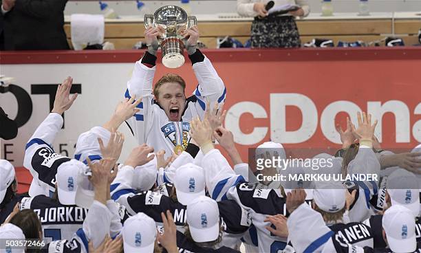 Captain Mikko Rantanen of Finland lifts the trophy and celebrates with his teammates after winning the world championship at the of the 2016 IIHF...