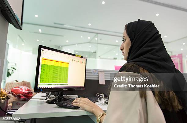 Riad, Saudi Arabia A young Arab woman sitting in front of a computer in the employment agency for women 'Glowork' on October 19, 2015 in Riad, Saudi...
