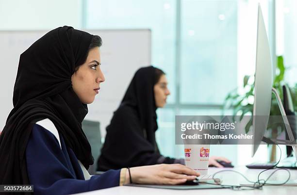 Riad, Saudi Arabia A young Arab women sitting in front of computers in the employment agency for women 'Glowork' on October 19, 2015 in Riad, Saudi...