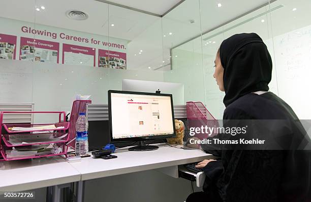Riad, Saudi Arabia A young Arab woman sitting in front of a computer in the employment agency for women 'Glowork' on October 19, 2015 in Riad, Saudi...