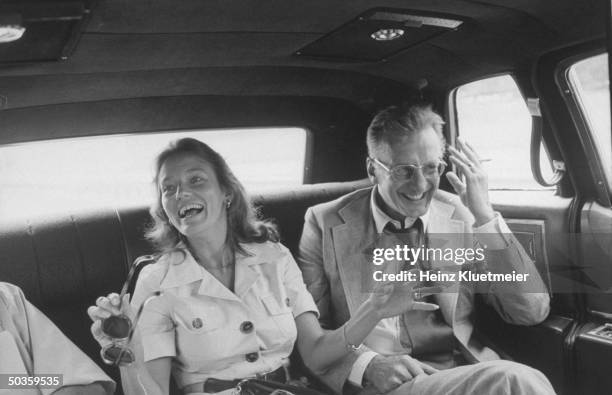 Actor George C. Scott and his wife Trish Van Devere riding in a car during their visit to the city of Union.