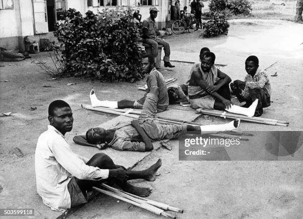 Biafran injured men lie on a street of Ikoi on July 1968. The overcrowed hospitals of the town can't take care of all the injured people. The Nigeria...