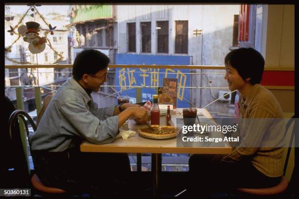 People eating in Pizza Hut restaurant.