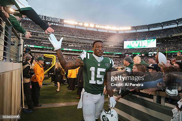 Wide Receiver Brandon Marshall of the New York Jets greets fans after the game against the New England Patriots at MetLife Stadium on December 27,...