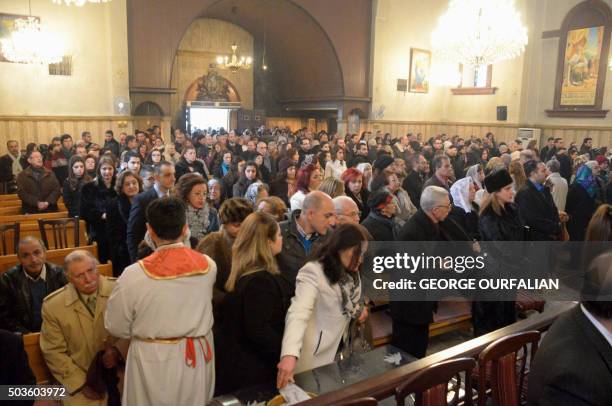 Armenian Orthodox worshippers attend a Christmas service at the Holy Mother of God Armenian Orthodox Church on January 6, 2016 in the northern Syrian...