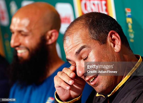 Coach Russell Domingo with Hashim Amla of South Africa who announced he will step down as captain after the match was drawn during day five of the...