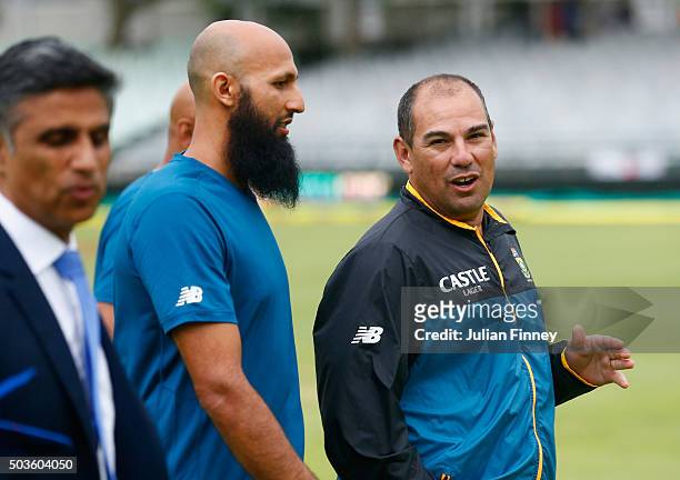 Coach Russell Domingo with Hashim Amla of South Africa after the match was drawn during day five of the 2nd Test at Newlands Stadium on January 6,...