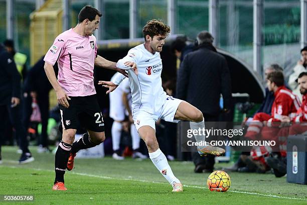 Palermo's midfielder from Croatia Mato Jajalo vies with Fiorentina's defender from Spain Marcos Alonso Mendoza during the Italian Serie A football...