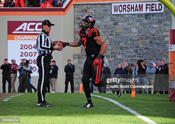 Bucky Hodges of the Virginia Tech Hokies hands the ball back to a referee after scoring a touchdown against the North Carolina Tar Heels on November...