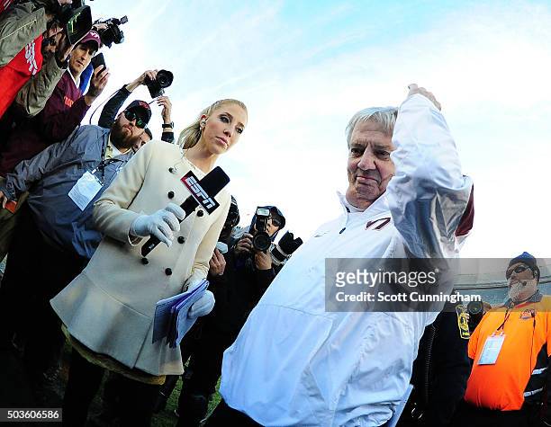 Head Coach Frank Beamer of the Virginia Tech Hokies prepares to be interviewed by Olivia Harlan after the game against the North Carolina Tar Heels...