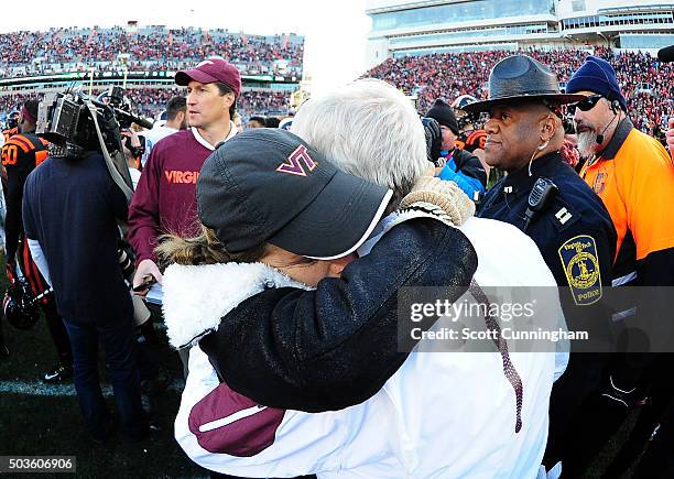 Head Coach Frank Beamer of the Virginia Tech Hokies is consoled by his wife Cheryl Beamer after the game against the North Carolina Tar Heels on...