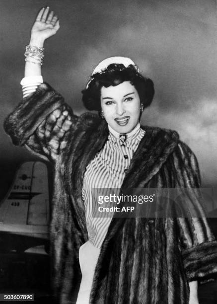 This photo taken on April 9, 1955 Shows Italian actress Silvana Pampanini waving upon her arrival at Kai Tak airport in Honk Kong, after landing from...