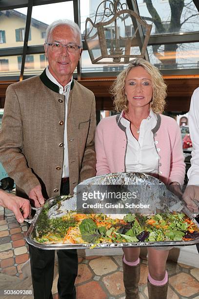 Franz Beckenbauer and his wife Heidi Beckenbauer with fish during the Neujahrs-Karpfenessen at Hotel zur Tenne on January 6, 2016 in Kitzbuehel,...