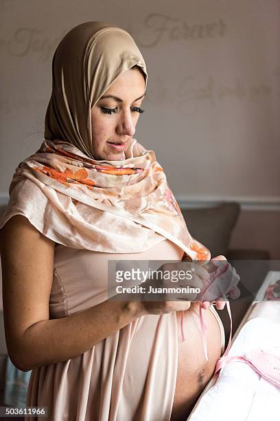 expecting middle eastern woman - pregnant muslim stock pictures, royalty-free photos & images