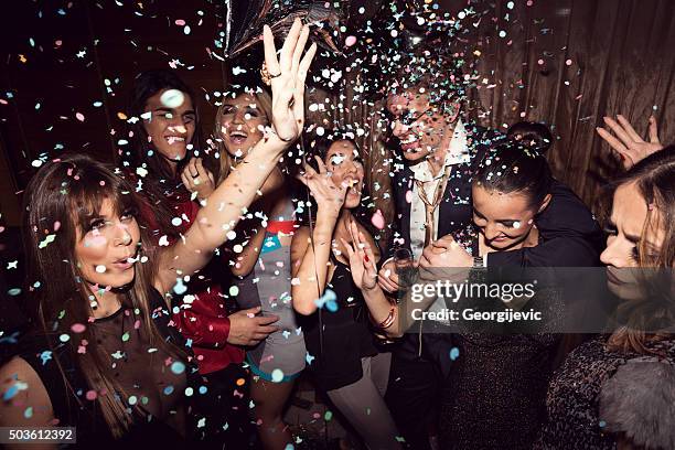 enjoying their night out - glamour stockfoto's en -beelden