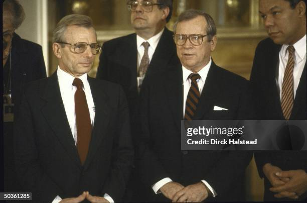 White House Chief of Staff Howard H. Baker Jr., Defense Secretary Frank C. Carlucci, and NSC Advisor Colin L. Powell attending a ceremony at the...