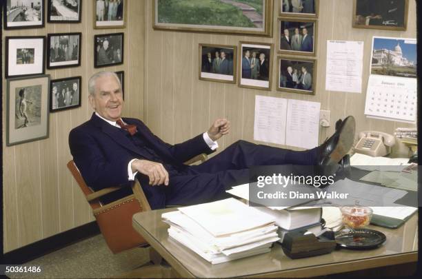 Rep. D-Ky. William H. Natcher, sitting with feet proped up on desk.