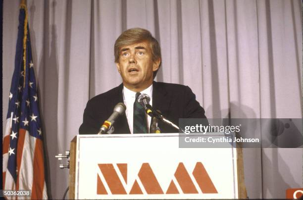Rep. Jack F. Kemp during National Association of Manufacturers debate on trade, with NAM trademark on podium.