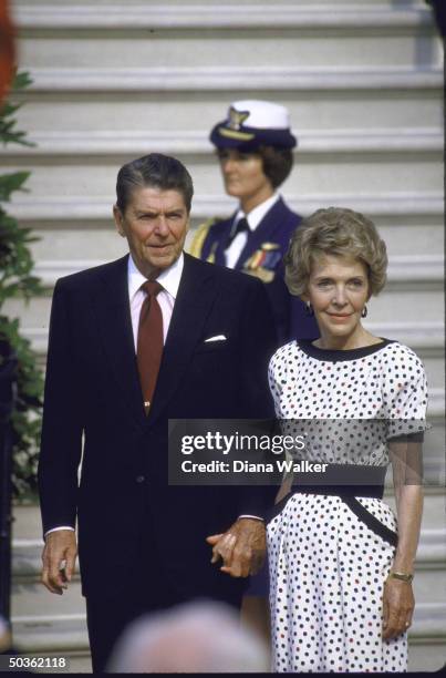 President Ronald W. Reagan [& Wife] during the visit of Prime Minister Poul Schluter of Denmark to the White House .