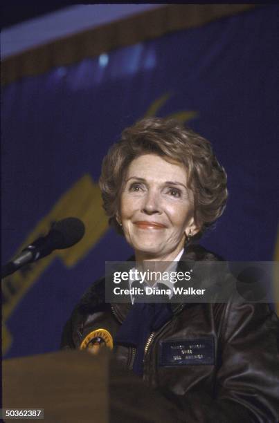 Nancy Reagan wearing Navy jacket given to her while on board USS America.