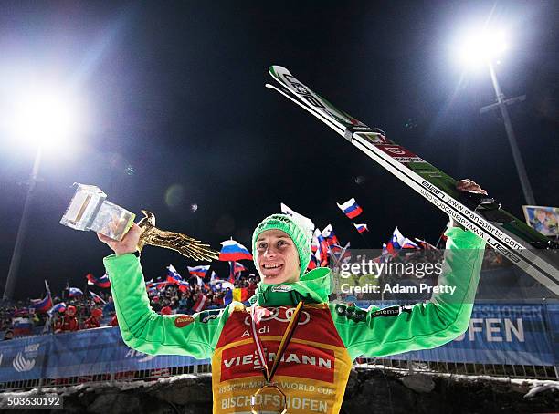 Peter Prevc of Slovenia celebrates victory and overall victory with the Four Hills trophy on day 2 of the 64th Four Hills Tournament in Bischofshofen...