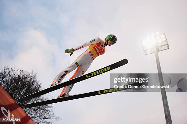 Peter Prevc of Slovenia soars through the air during his trial jump on Day 2 of the Bischofshofen 64th Four Hills Tournament ski jumping event on...